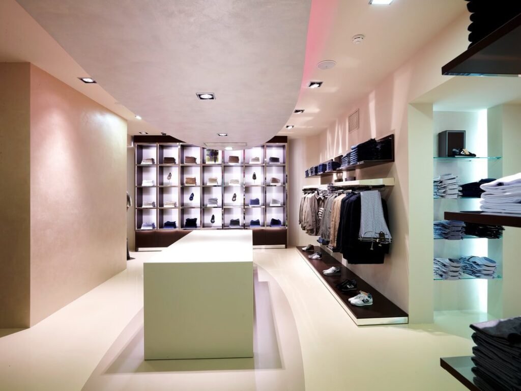 Retail unit fitted with LED strip lighting and illuminated display shelving